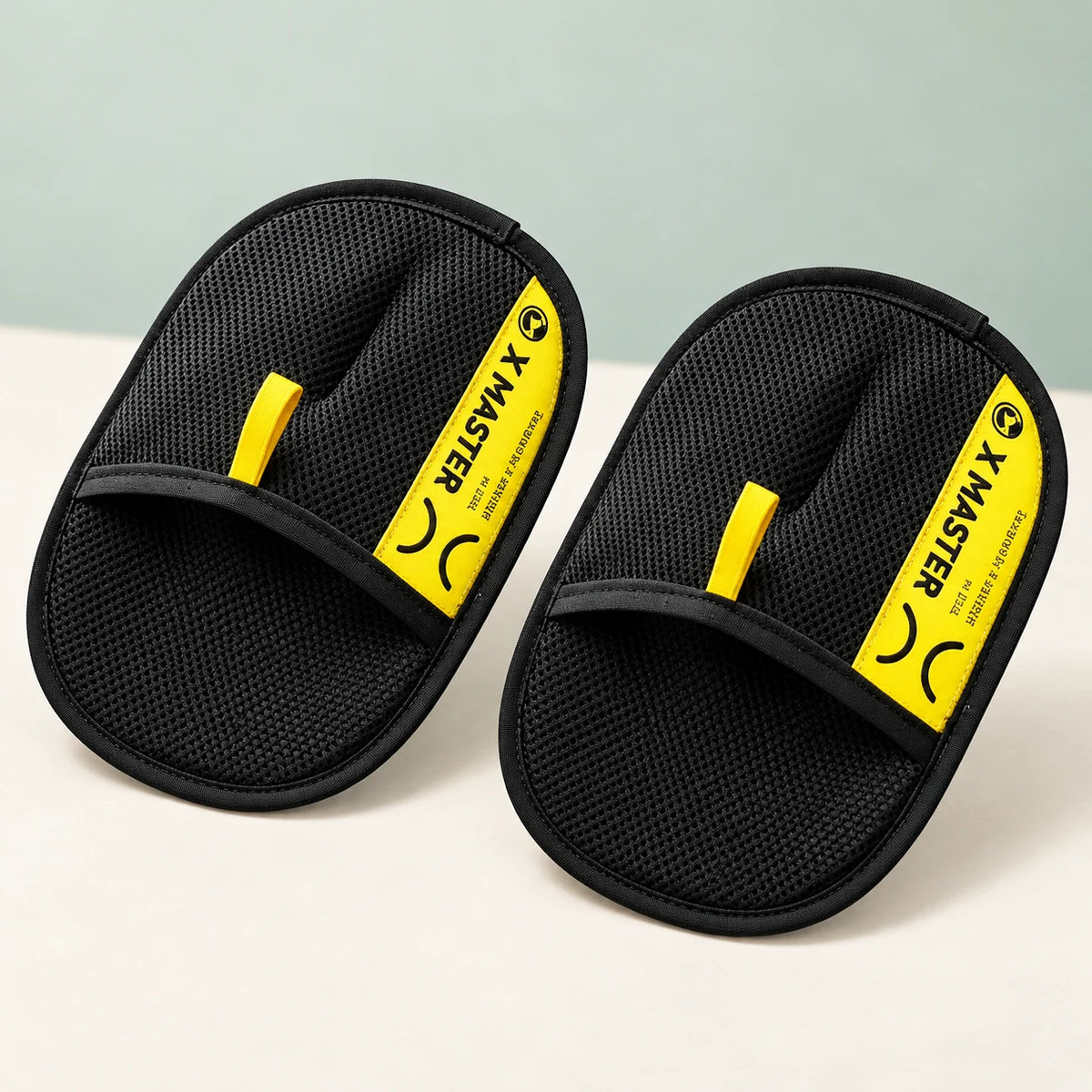 Styled illustration of two XMASTER pet hair gloves